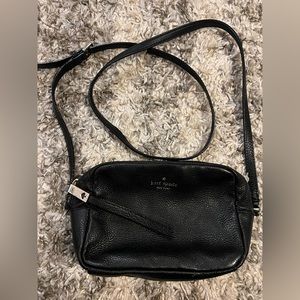 Black Kate Spade pebbled leather camera bag w/ tassel